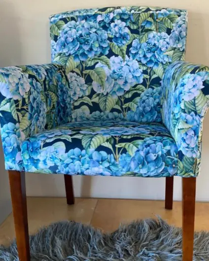 The same tub chair recovered in a blue hydrangea print.