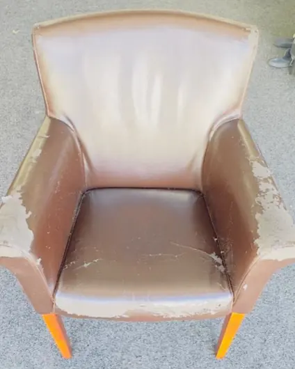 The tub chair as it came in: brown leather, worn through on the arms and seat.