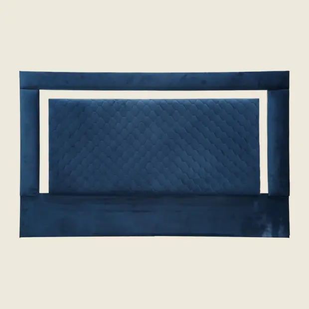 Quilted navy headboard with a chrome inlay strip, front view.