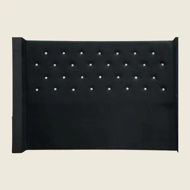Wingback headboard with button tufting, front view.