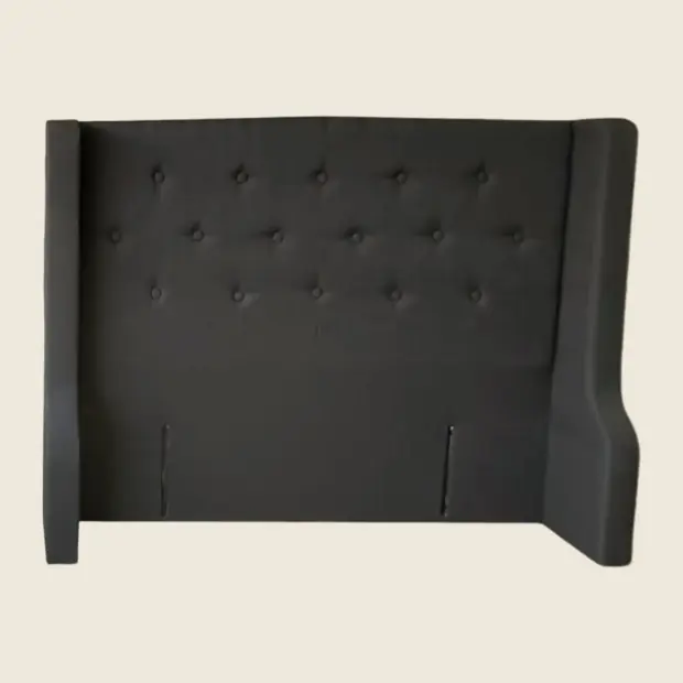 Charcoal wingback headboard with deep button tufting, front view.